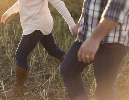 married couple walking hand in hand.jpg