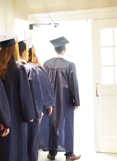 graduation-standing-at-door